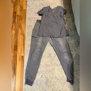 Figs tall  Gray scrubs